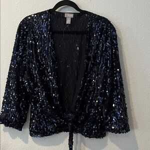 Chico's Black Sequin Cropped Jacket
Ties at waist, Long Sleeves
Sparkling
Sz 3
L